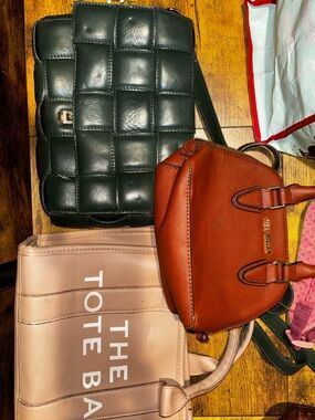 Lot of small hand bags. These are all well loved.